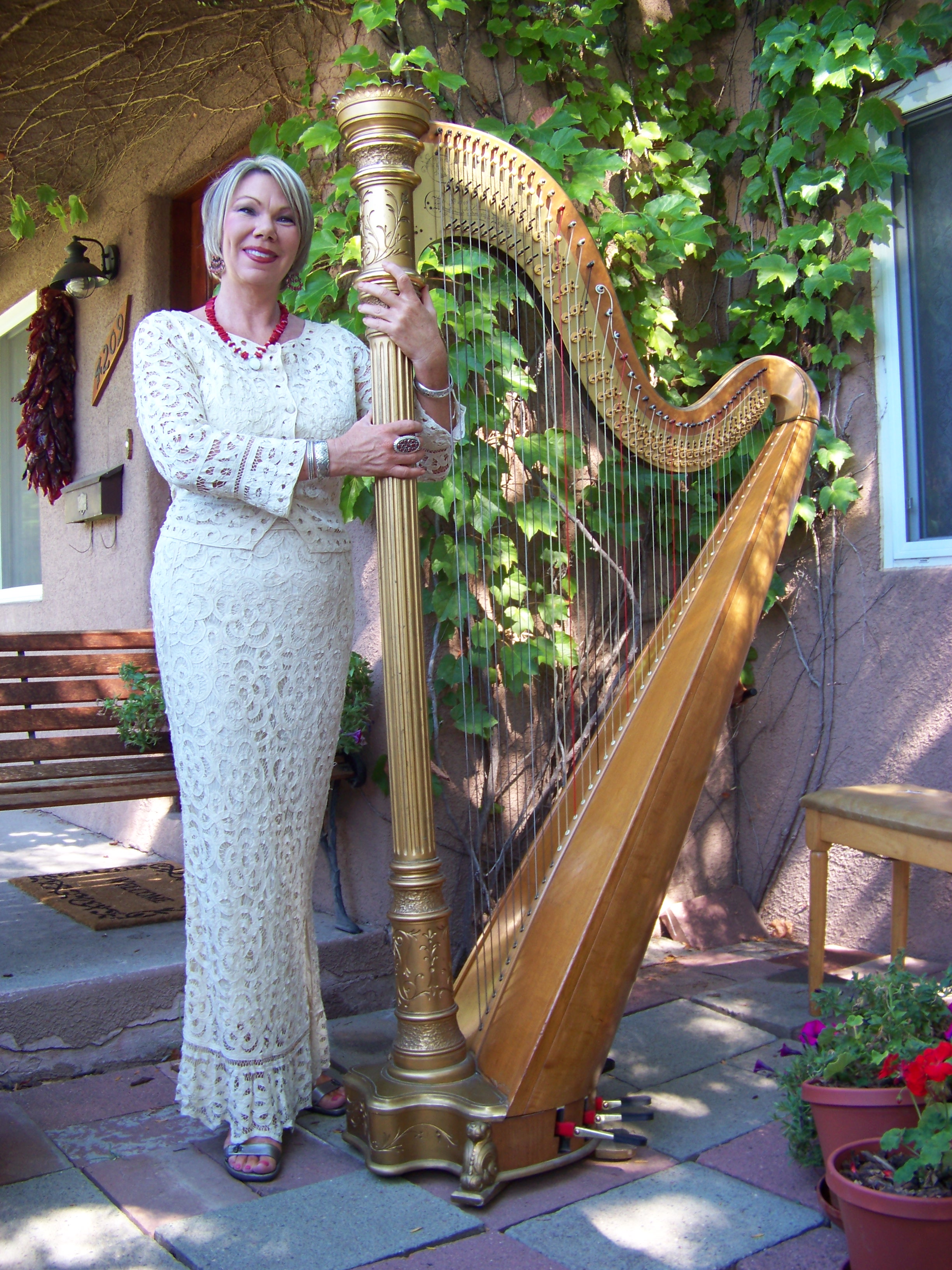 Harpist Julianne Rivera sitting by her harp